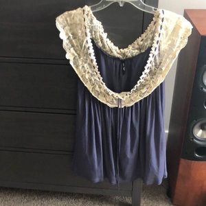 Beautiful shirt with lace around collar.